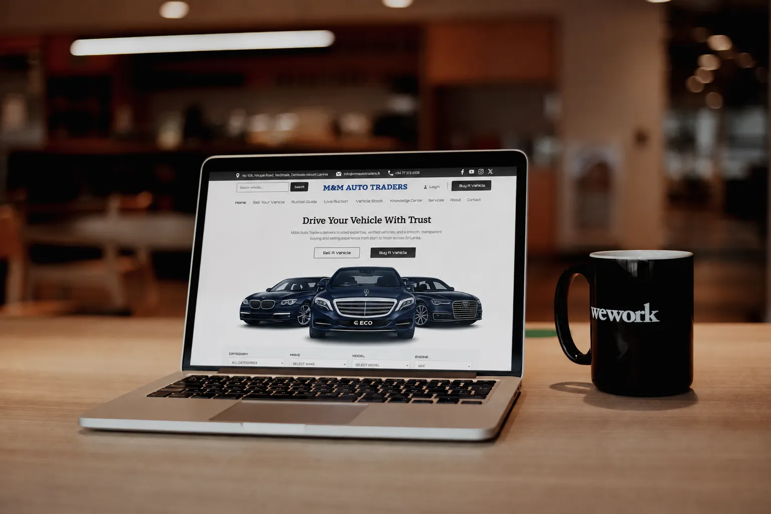 MM Auto Traders automotive website preview on a laptop